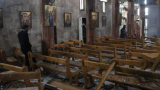 Attendant dans une église à Damas: Le bilan s'alourdit...